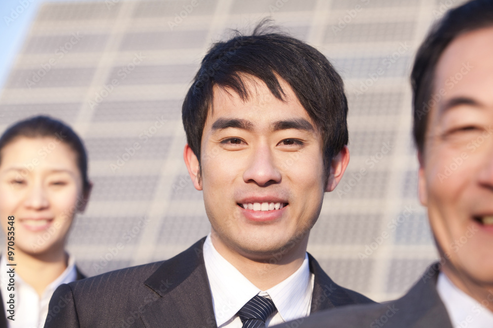 Three Businesspeople in front of Solar Panel Three Businesspeople in front of Solar Panel