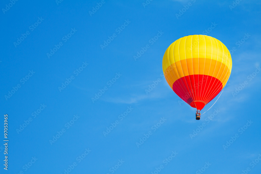 Naklejka premium colorful hot air balloon on blue sky