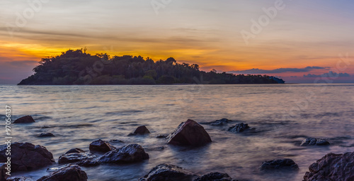 HDR rock on sea beach at sunset