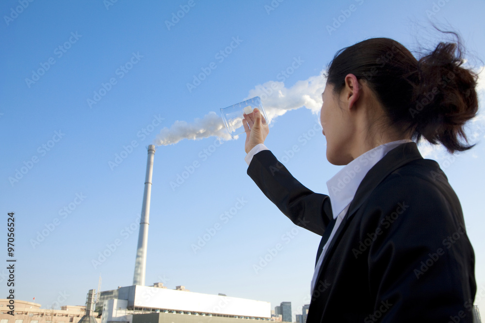 Plakat Businesswoman Collecting Smoke in Beaker