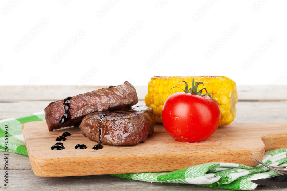 Steak with grilled corn and tomato