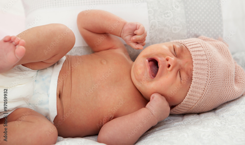 Beautiful baby with wool cap crying Beautiful baby with wool cap crying