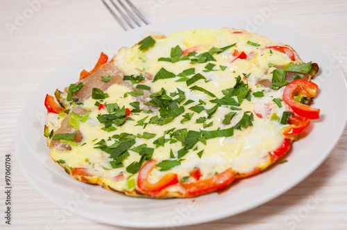 omelet with bacon, vegetables and cheese