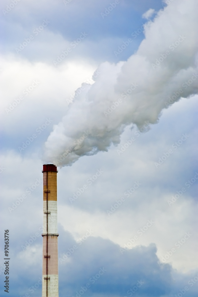 Smoking chimneys against the sky