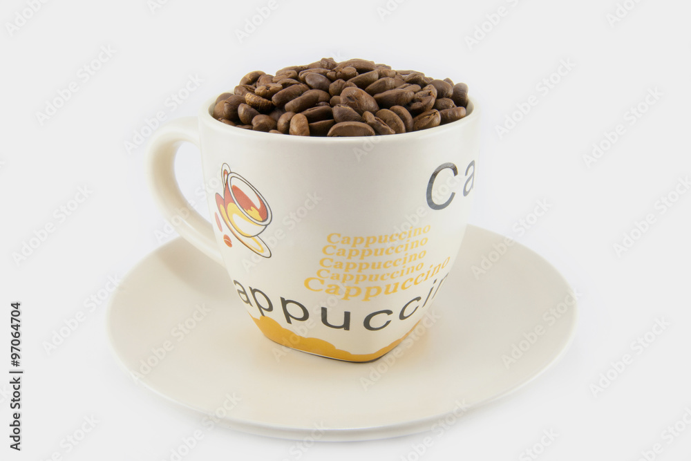 Cup full of coffee beans isolated Cup full of coffee beans isolated