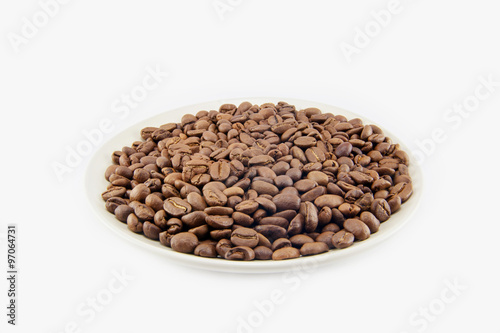 Cup full of coffee beans isolated