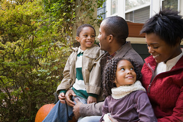 Family in front of house