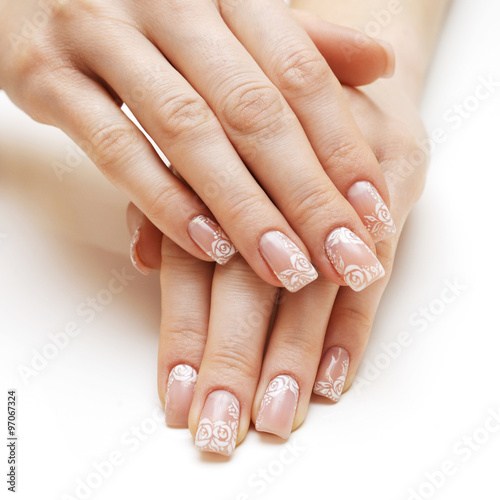 Beautiful female hands with french manicure isolated