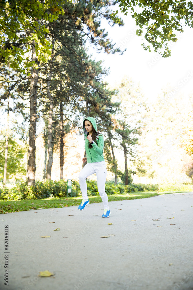 Young woman running in the park Young woman running in the park