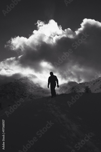 Man hiking - peak mountain - contrast bw