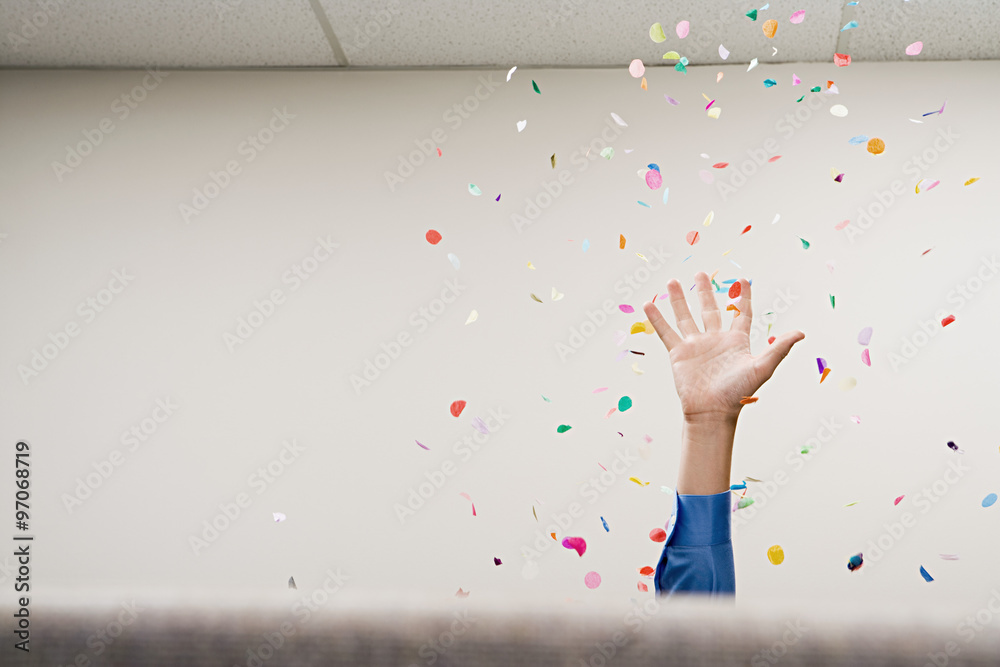 Businessman throwing confetti in the air - obrazy, fototapety, plakaty 