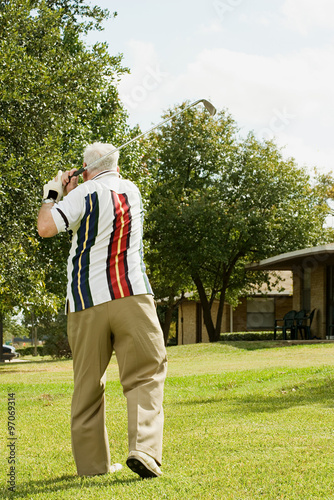 Senior man playing golf