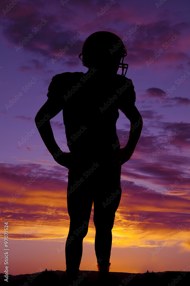 silhouette of football player standing