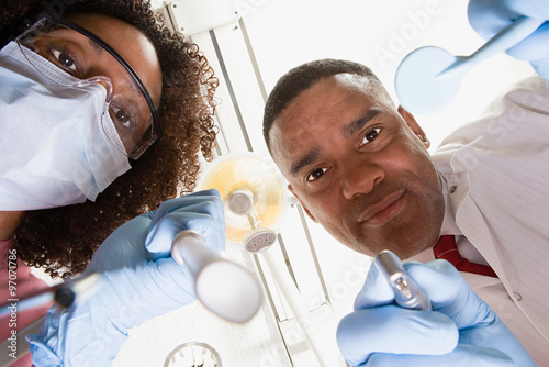 Принти на полотні Low angle view of dentist and dental nurse