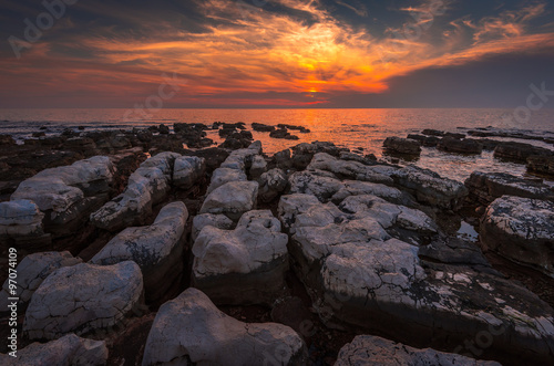 Sunset Over the Sea with Rocks in Foreground