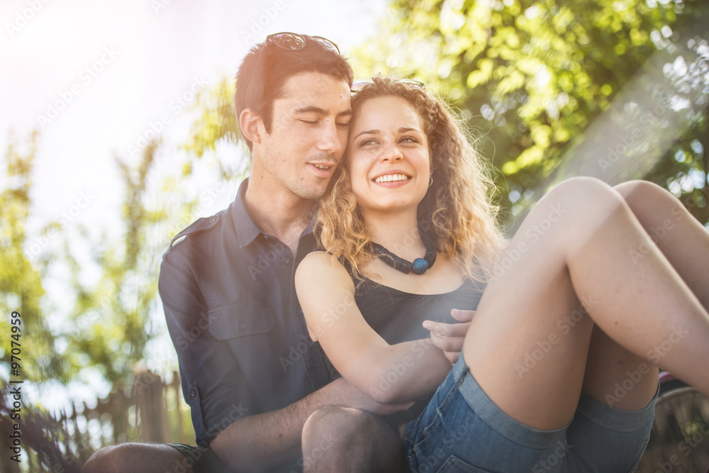 Fototapeta premium Couple relaxing after a ride in the park with bicycles. Healthy