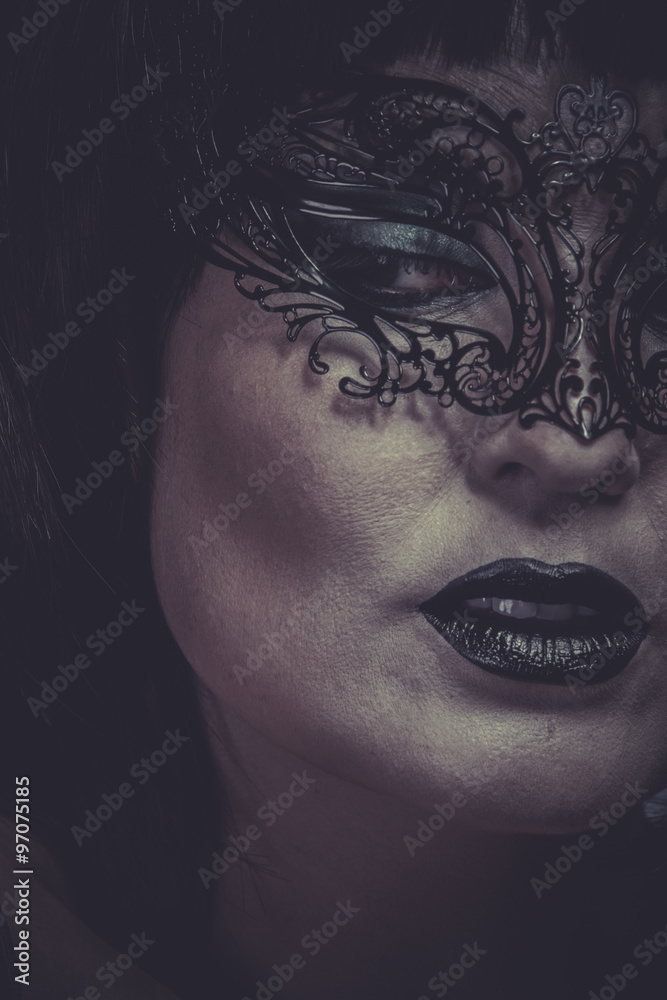 Makeup, portrait of woman with black mask thread Venetian