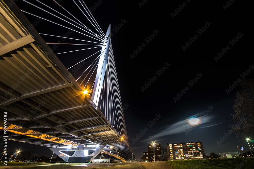 Night portrait of a cable stayed bridge in Utrecht, the Netherlands called the Prins Claus Bridge