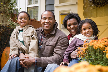 Family in front of house