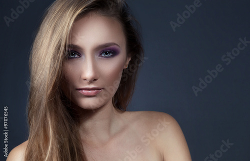 Portrait of beautiful woman with bright evening make up.