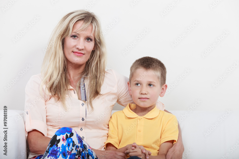 Happy family. Mother and kid on sofa at home. Happy family. Mother and kid on sofa at home.
