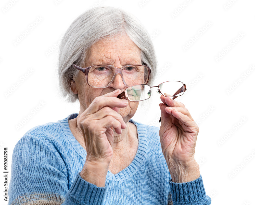 Senior woman choosing a suitable pair of glasses
