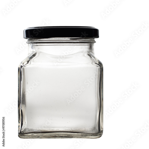 Old glass jar with lid isolated on black. Empty. photo
