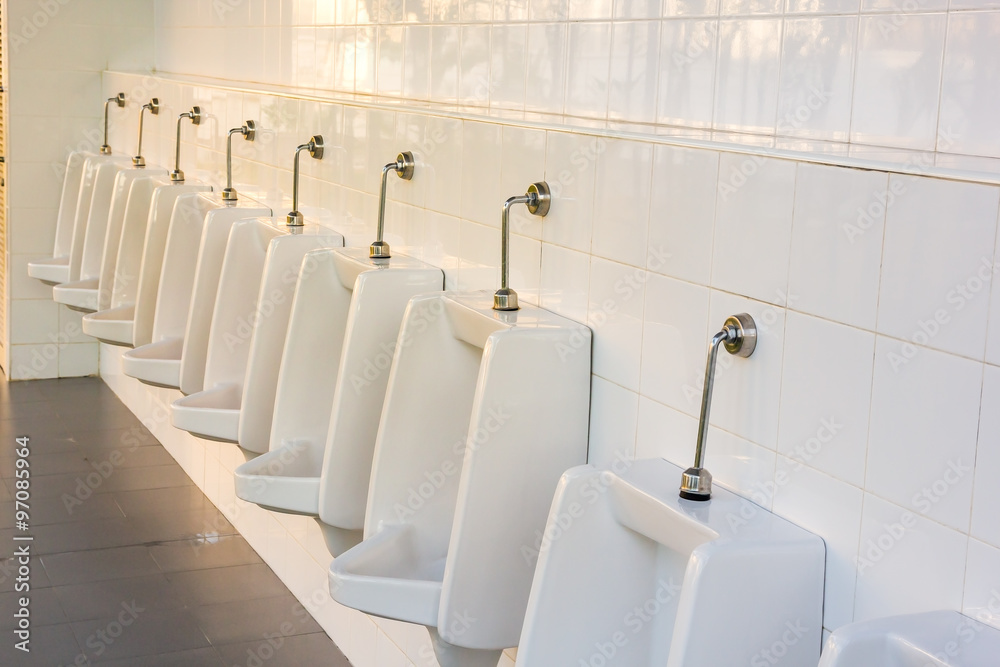 line of white porcelain urinals in public toilets Stock Photo Adobe Stock
