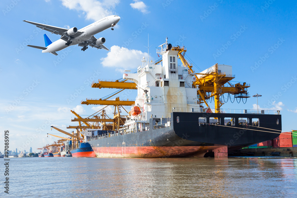 Container cargo freight ship with working crane loading bridge 