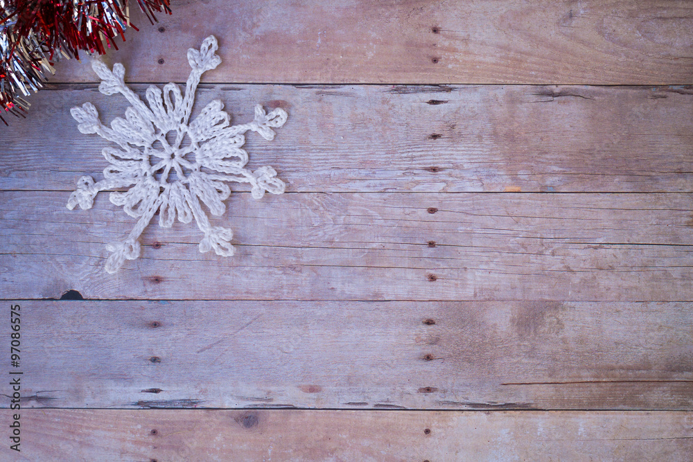 Snowflake Ornament on a wood background. Snowflake Ornament on a wood background.