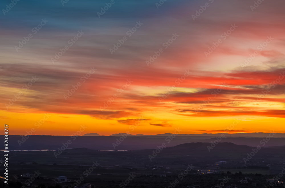 sunset scene with mountains in background