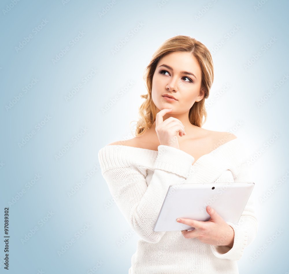 Young and beautiful housewife woman cooking in a kitchen Young and beautiful housewife woman cooking in a kitchen