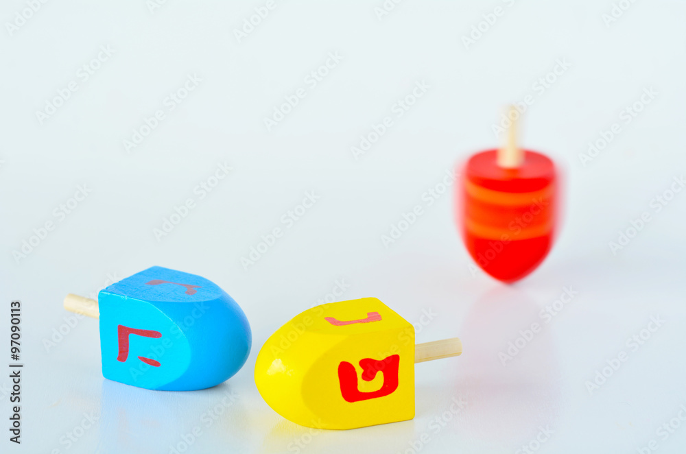 Dreidels (sevivons) during the Jewish holiday of Hanukkah Dreidels (sevivons) during the Jewish holiday of Hanukkah