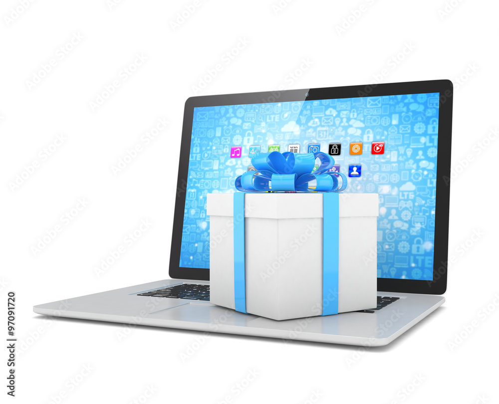 Gift box with ribbon bow on laptop keyboard Gift box with ribbon bow on laptop keyboard