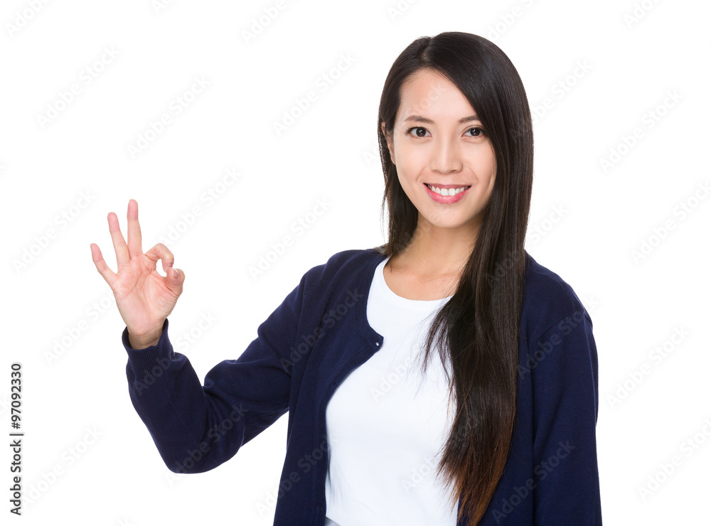 Young woman showing ok sign gesture Young woman showing ok sign gesture