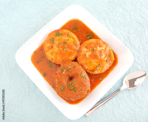Idli and vada, two of the traditional and popular south Indian vegetarian food is eaten with sambar.