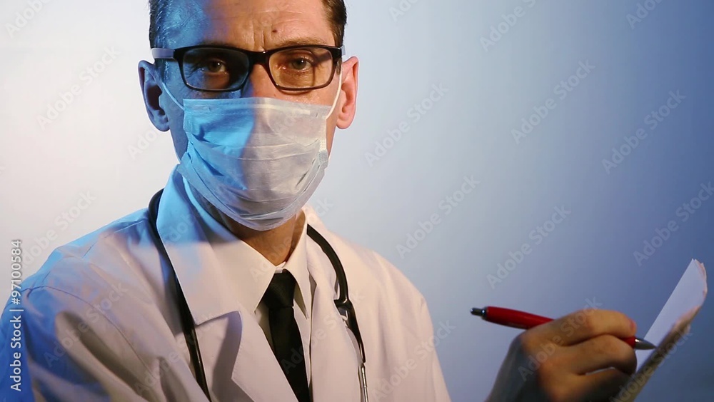 doctor in medical mask is writing doctor in medical mask is writing