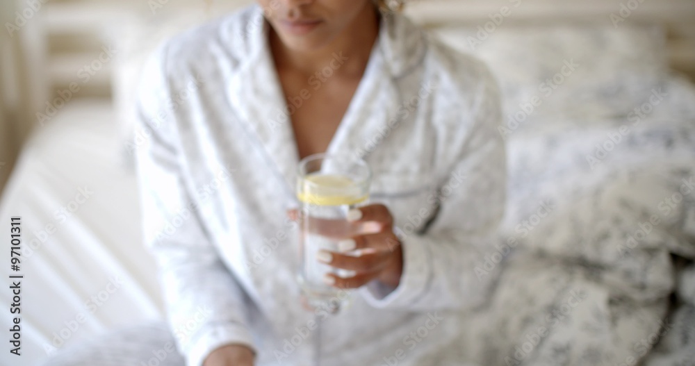 Woman Taking Pills On The Bed. Woman Taking Pills On The Bed.