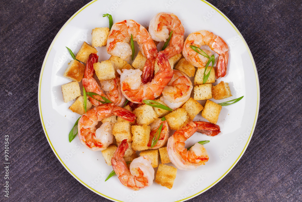 Shrimp with crispy croutons and scallions. View from above, top studio shot Shrimp with crispy croutons and scallions. View from above, top studio shot