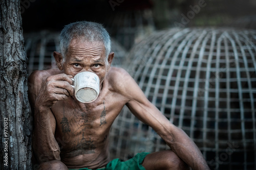 Old man drinking coffee