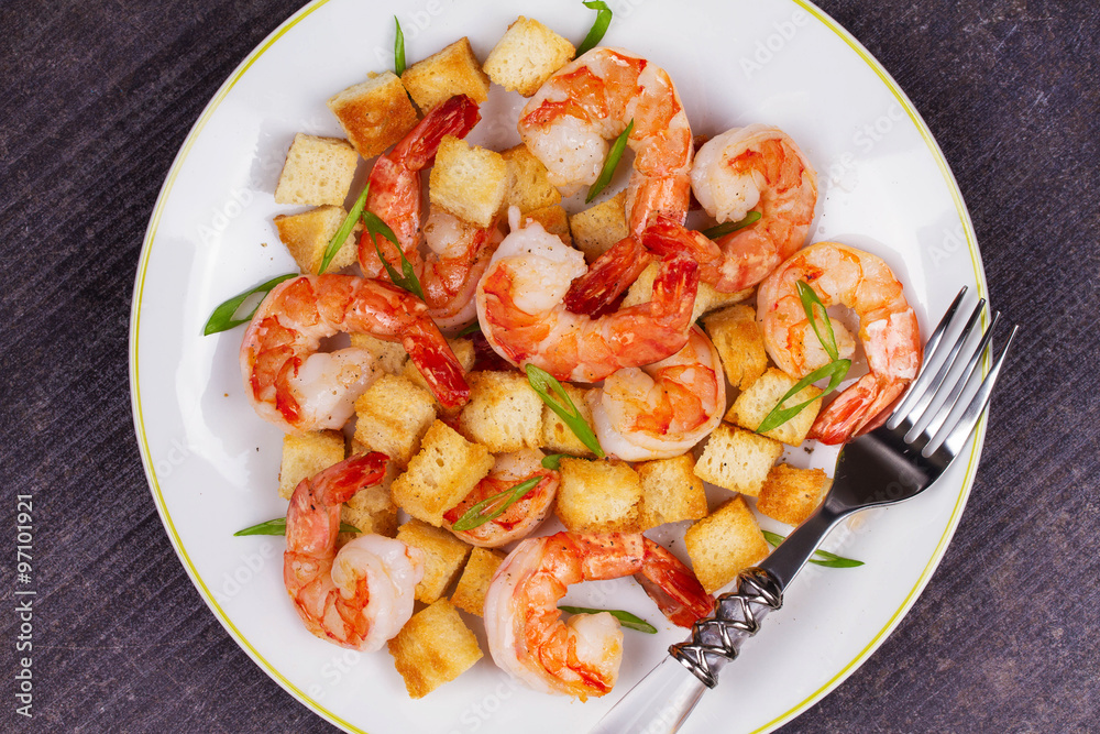 Shrimp with crispy croutons and scallions. View from above, top studio shot Shrimp with crispy croutons and scallions. View from above, top studio shot