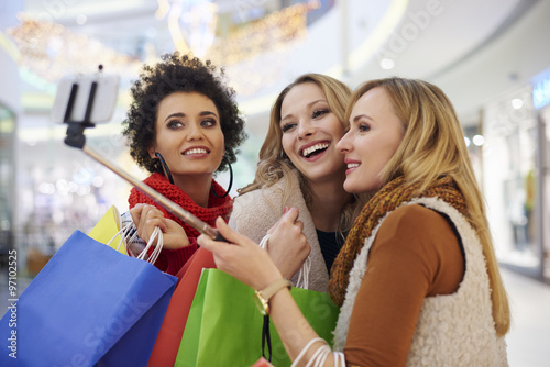 Women taking selfie in the shopping mall.