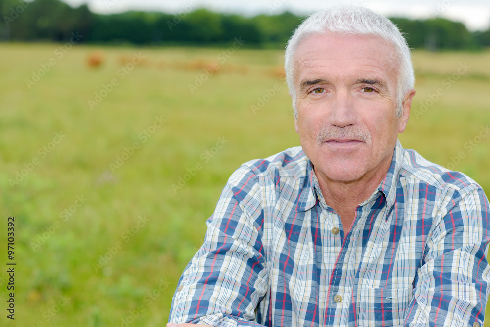 Portrait of mature man in field