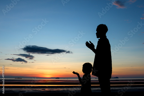 Father and son praying