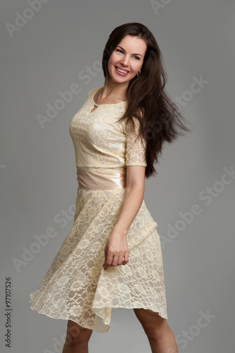 young beautiful caucasian brunette in dress