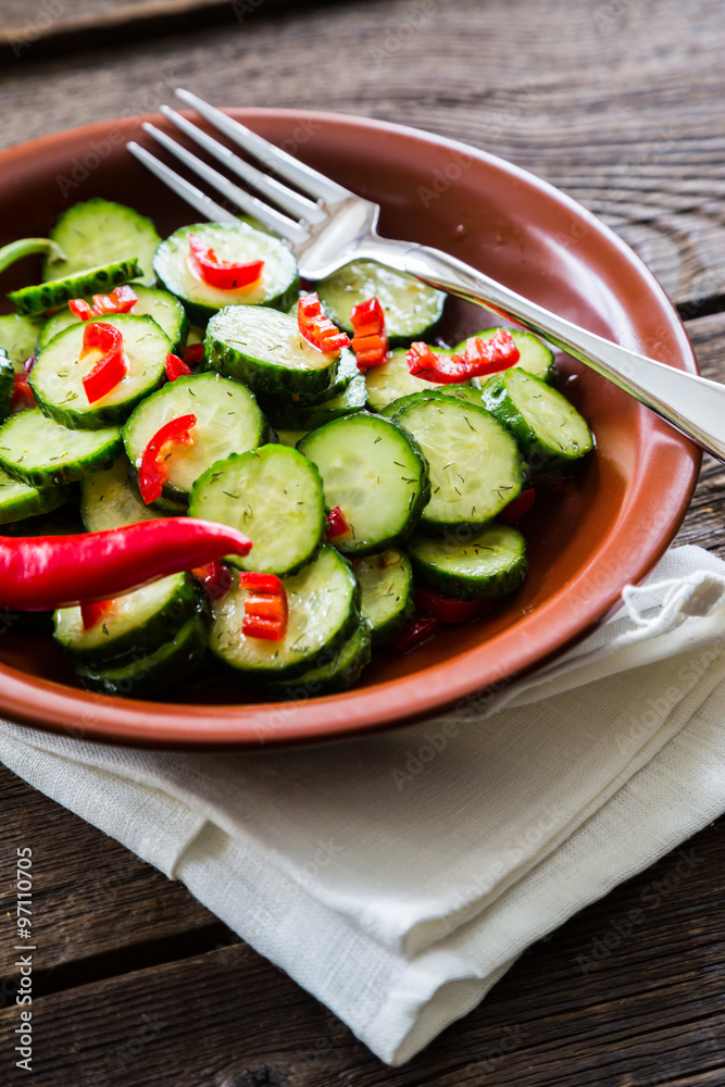Fresh salad of cucumbers with red hot chili pepper Fresh salad of cucumbers with red hot chili pepper