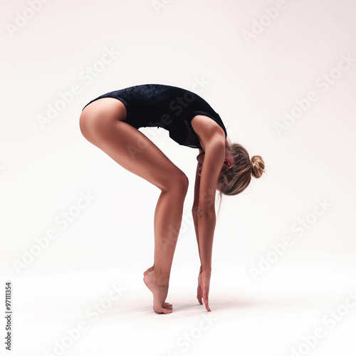 young beautiful dancer in black swimsuit