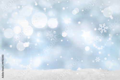 Weihnachtlicher Bokeh-Hintergrund in blau-weiß Farben mit Schnee photo