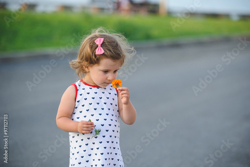 Girl Smelling Flower © photographmd