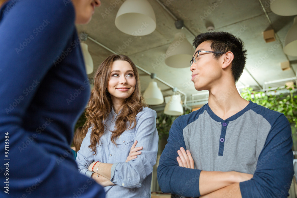 Fototapeta premium Beautiful woman and young asian man looking on each other